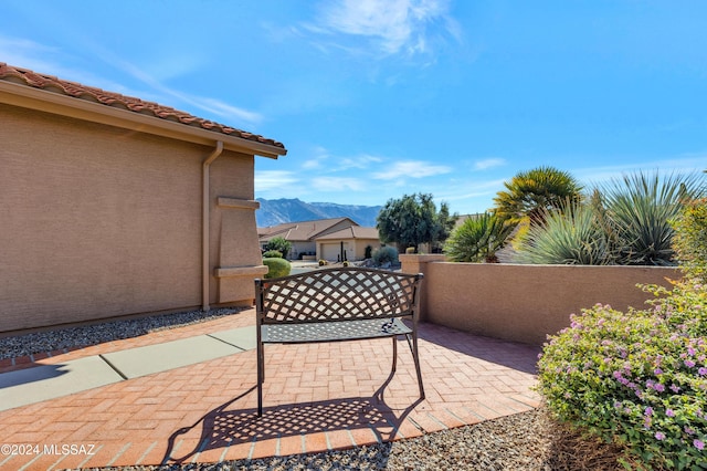 view of patio / terrace featuring a mountain view