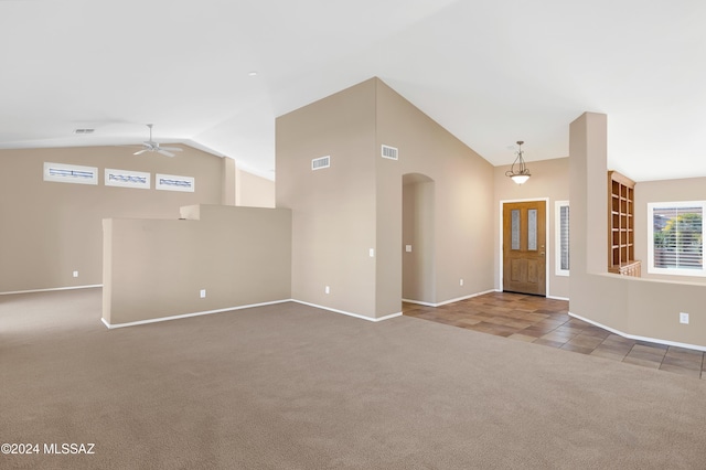 interior space with vaulted ceiling and ceiling fan