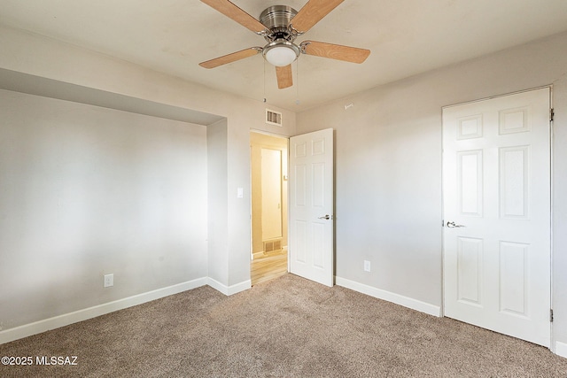 unfurnished bedroom with carpet flooring and ceiling fan