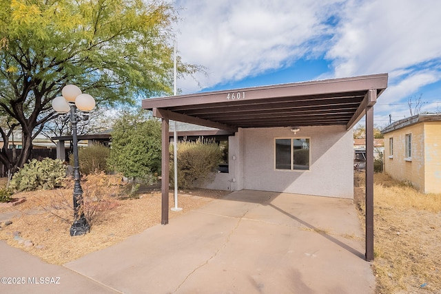 exterior space featuring a carport