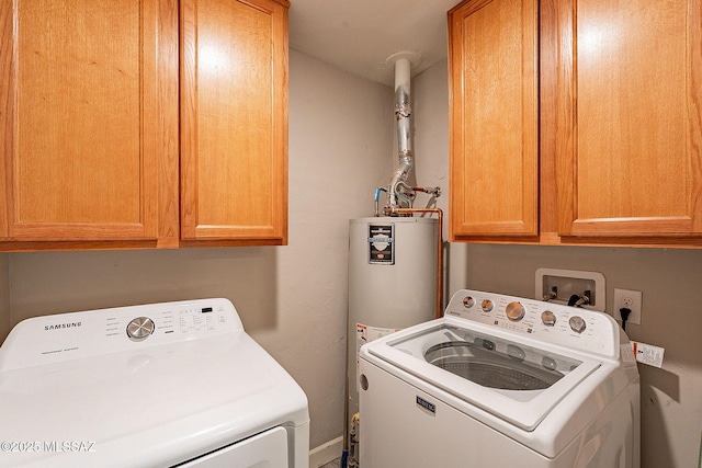 clothes washing area with cabinets, separate washer and dryer, and water heater