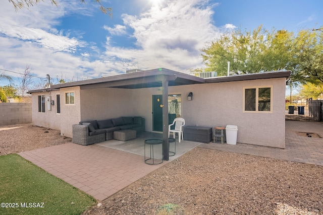 rear view of house featuring an outdoor hangout area and a patio area