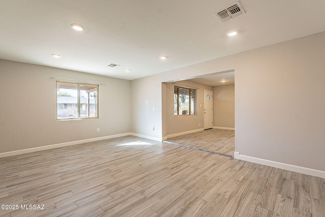 spare room featuring light hardwood / wood-style flooring