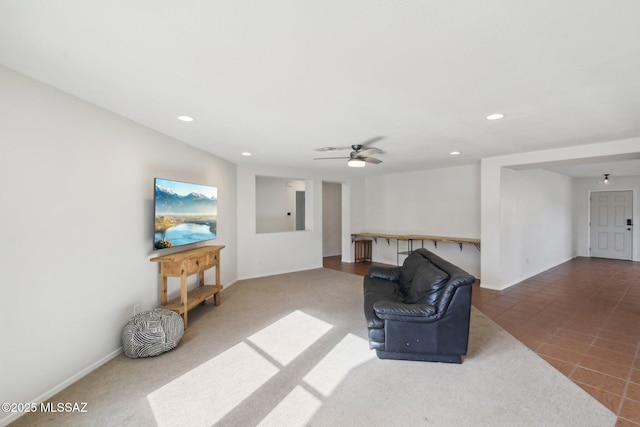 tiled living room with ceiling fan