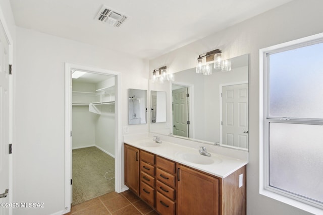 bathroom featuring tile patterned floors and vanity