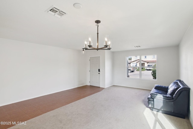 sitting room with tile patterned floors and a notable chandelier