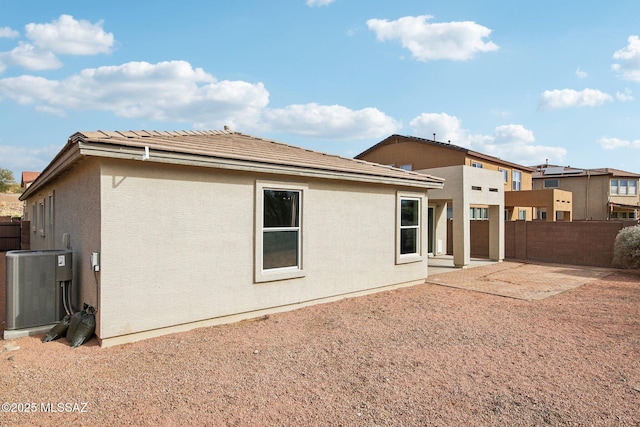 back of property featuring a patio area and central AC unit