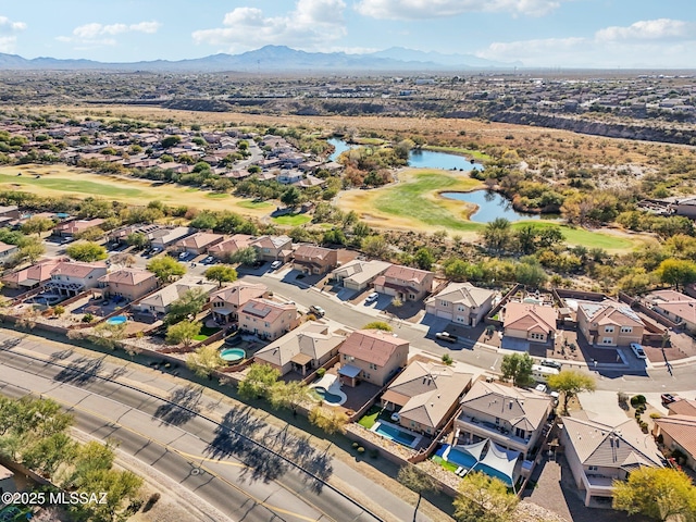 aerial view featuring a water and mountain view