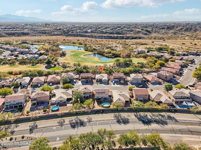 drone / aerial view featuring a water and mountain view