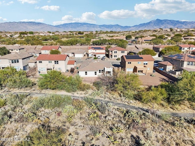 birds eye view of property with a mountain view