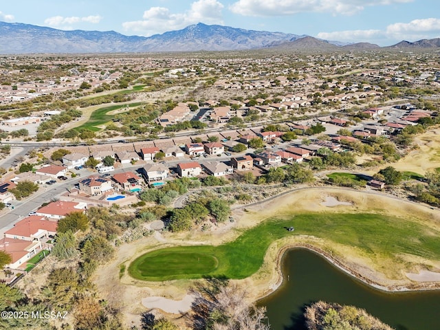 drone / aerial view with a water and mountain view