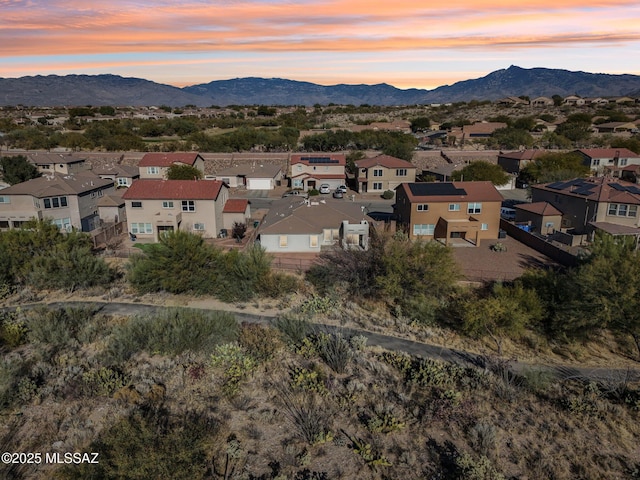 aerial view at dusk with a mountain view