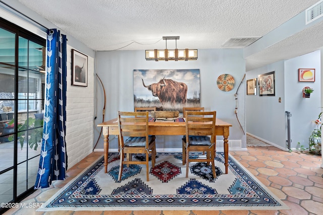 dining room featuring a textured ceiling