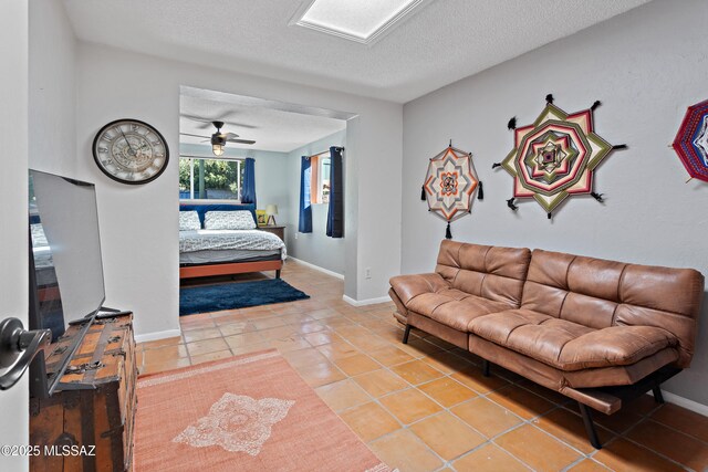 bedroom featuring ceiling fan, a textured ceiling, and visible vents