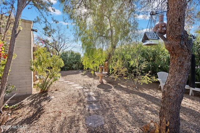 exterior space featuring fence and concrete driveway