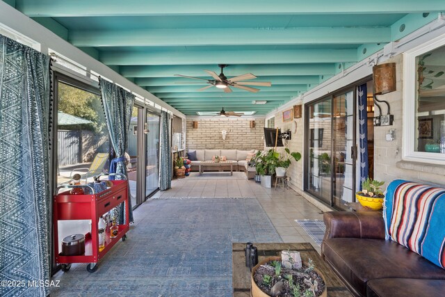 sunroom / solarium with tile patterned floors
