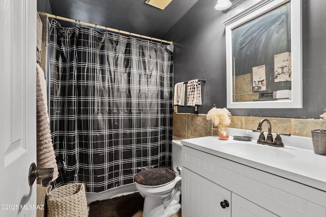 bathroom with vanity, walk in shower, and toilet