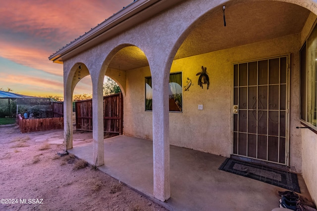 view of patio terrace at dusk