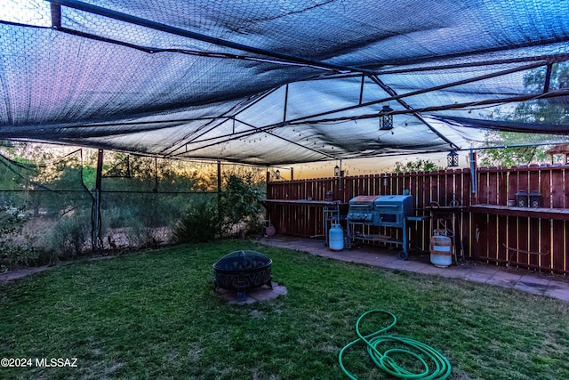 view of yard with an outdoor fire pit