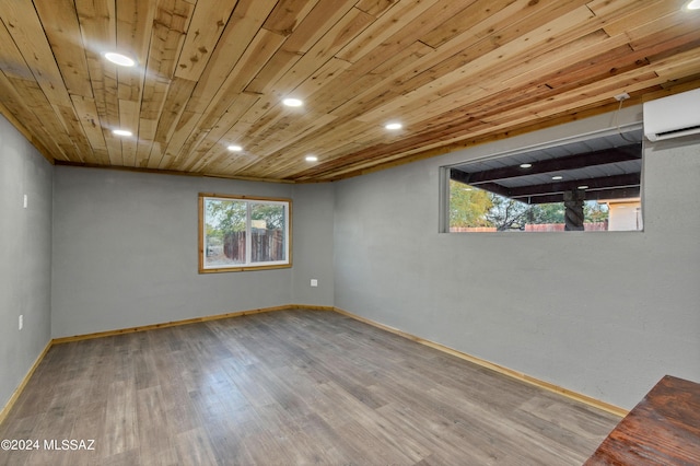 basement featuring hardwood / wood-style flooring, a wall unit AC, and wood ceiling