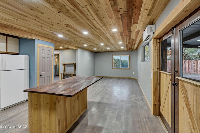 kitchen featuring wooden counters, light wood-type flooring, white fridge, wood ceiling, and a wall unit AC