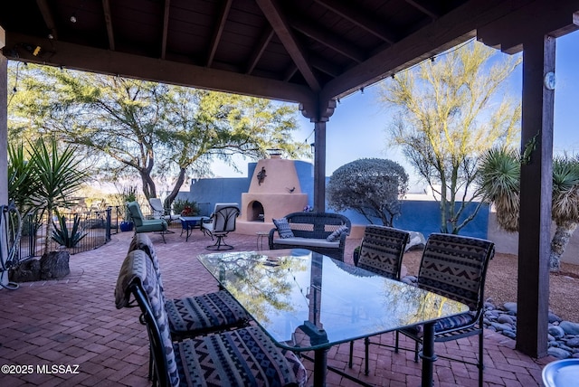 view of patio / terrace featuring an outdoor fireplace