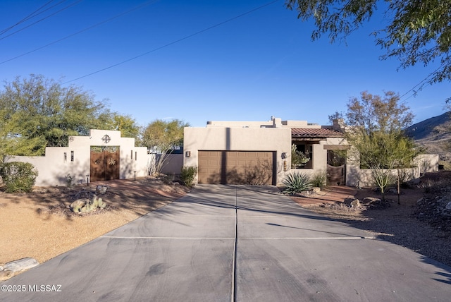 southwest-style home featuring a garage