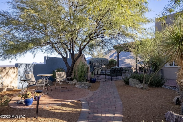 view of patio / terrace with a mountain view