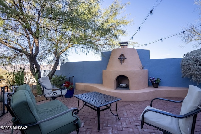 view of patio featuring an outdoor fireplace