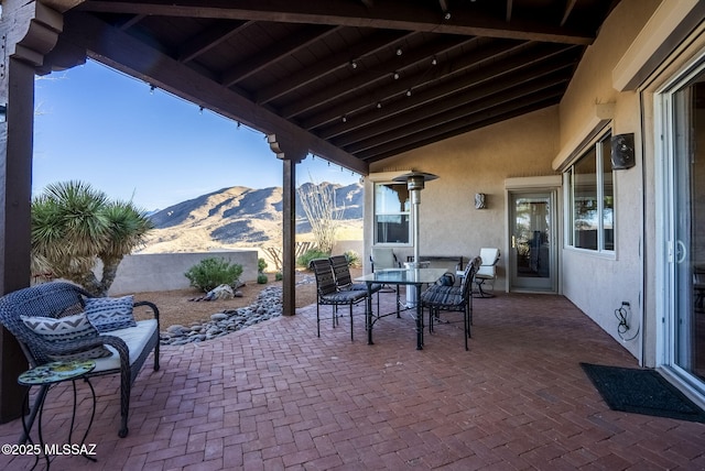 view of patio / terrace with a mountain view