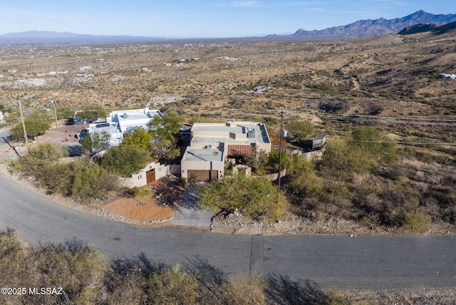 birds eye view of property featuring a mountain view