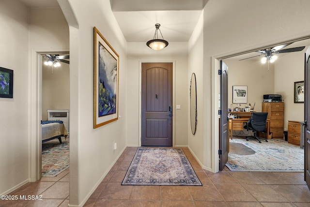 entryway featuring ceiling fan