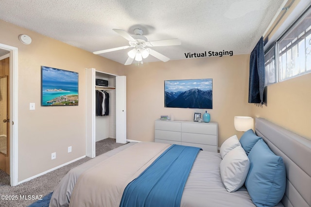 carpeted bedroom with ceiling fan, a closet, and a textured ceiling