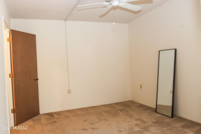 spare room with light carpet and ceiling fan