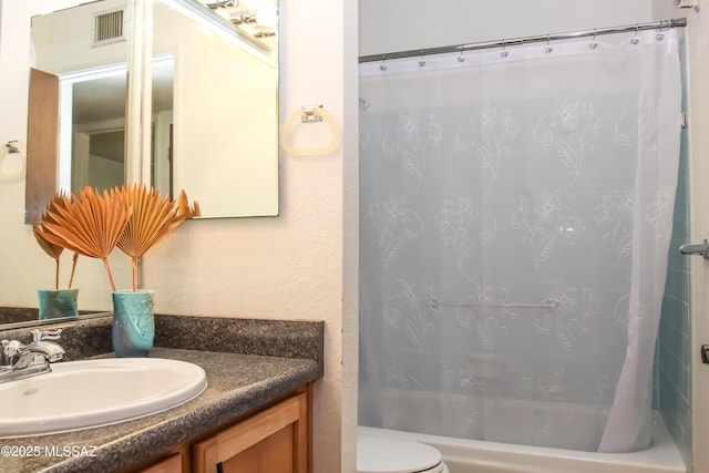 full bathroom with toilet, shower / bath combo, vanity, and visible vents