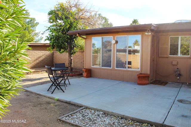 view of patio / terrace featuring fence