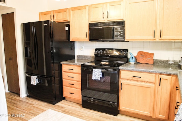 kitchen featuring backsplash, light brown cabinets, black appliances, and light wood-type flooring