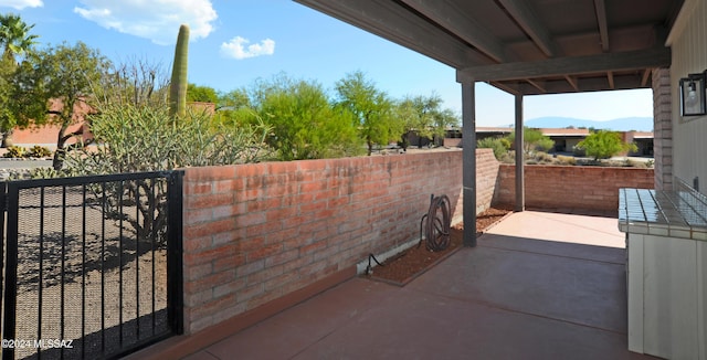 view of patio / terrace featuring a mountain view