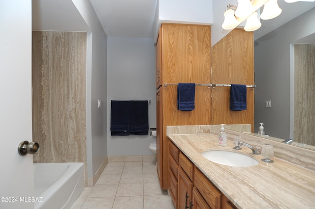 bathroom featuring toilet, vanity, and tile patterned floors