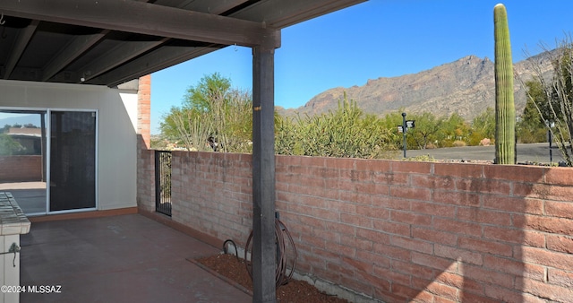 view of patio / terrace with a mountain view