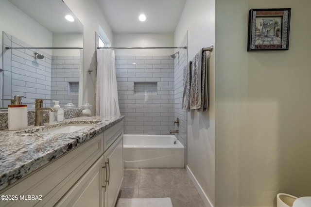 bathroom with baseboards, shower / bath combo with shower curtain, tile patterned floors, and vanity
