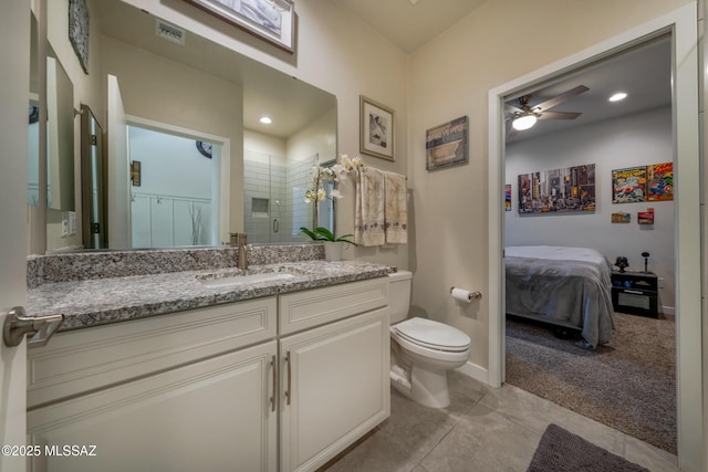 full bath with a shower stall, visible vents, toilet, vanity, and ceiling fan