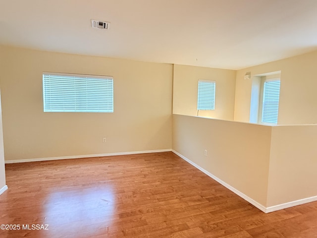 unfurnished room featuring light hardwood / wood-style flooring