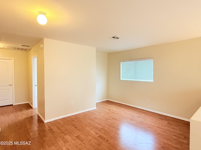 empty room with wood-type flooring