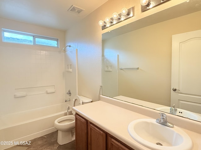 full bathroom featuring tile patterned floors, vanity, toilet, and shower / washtub combination