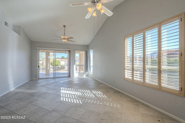 empty room with ceiling fan, high vaulted ceiling, visible vents, and baseboards