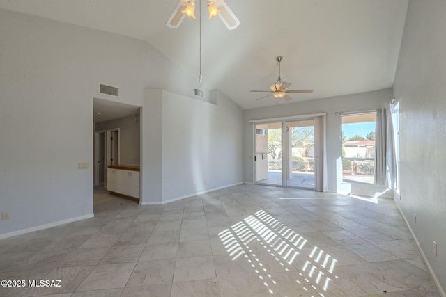 unfurnished living room with a ceiling fan, visible vents, high vaulted ceiling, and baseboards