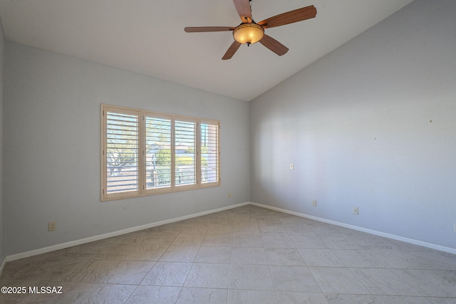 empty room with ceiling fan, baseboards, and vaulted ceiling