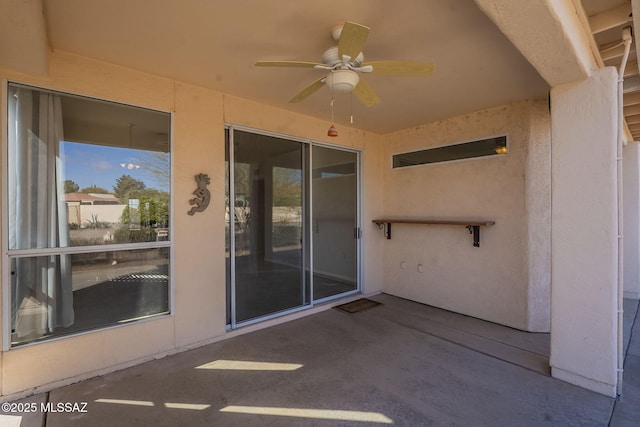 view of patio featuring ceiling fan