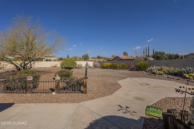 view of yard with a fenced backyard and a patio